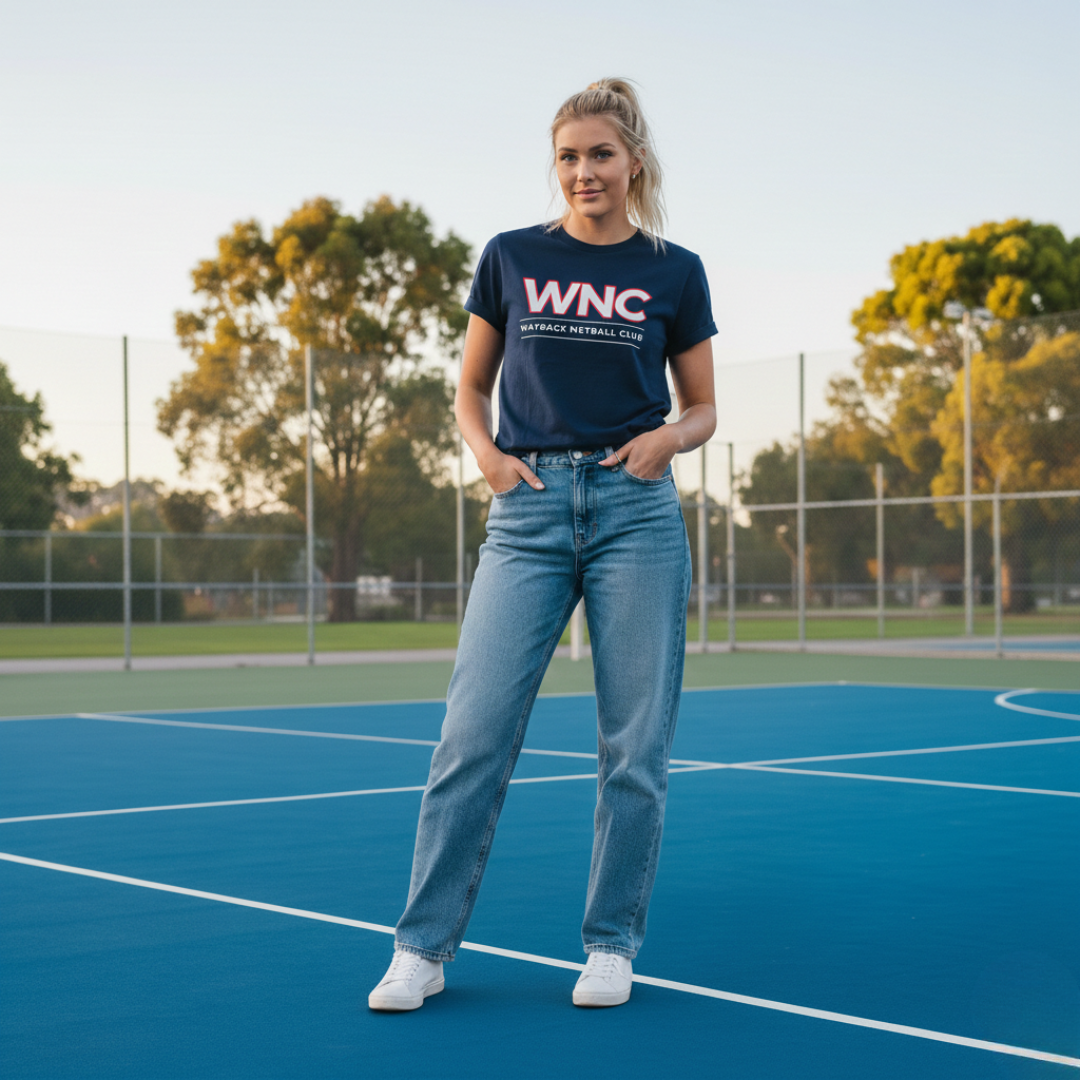 Woman wearing a navy t-shirt with 'WNC' on a netball court