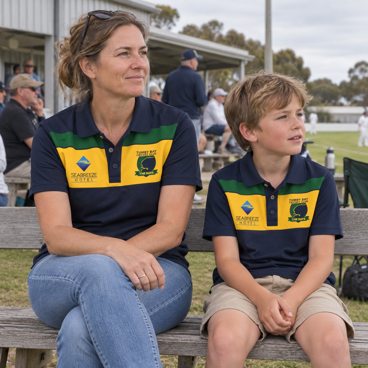 Mum and son wearing the Tumby Bay Cricket Club supporters polo - panel at the cricket