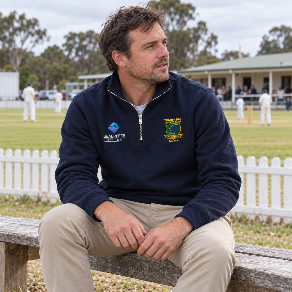 Man wearing the Tumby Bay Cricket Club navy 1/4 zip at the cricket